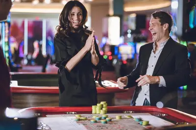 a man and a woman playing roulette in a casino at The Kartrite Resort and Indoor Waterpark in Monticello