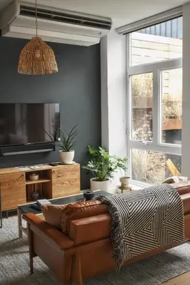 a living room with a couch and a table at Lokal Hotel Fishtown in Philadelphia