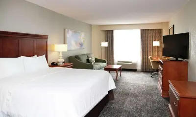 a hotel room with a bed and a television at Hampton Inn Parsippany in Parsippany