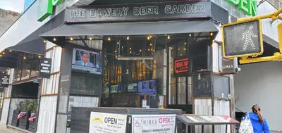 a building with a sign for the brewery beer garden at Wyndham Garden Chinatown in New York