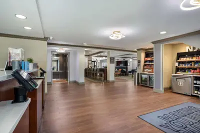 a lobby of a store with a cash register and a waiting room at Hampton Inn Princeton in Princeton
