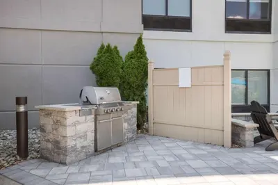 a grill on a patio outside of a building at Hampton Inn Princeton in Princeton