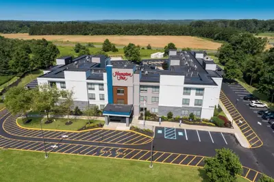 an aerial view of a hotel with a parking lot at Hampton Inn Princeton in Princeton