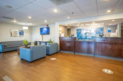 a waiting area in a hospital with a waiting room at Holiday Inn Express - Newark Airport - Elizabeth by IHG in Elizabeth
