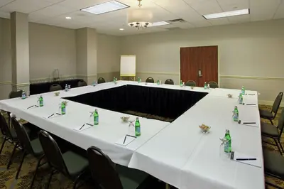 a meeting room with a long table with chairs at DoubleTree by Hilton Mahwah in Mahwah