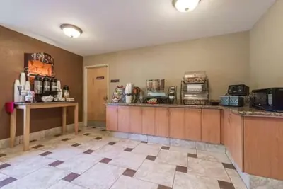 a large kitchen with a counter in a room at Microtel Inn & Suites by Wyndham West Chester in West Chester