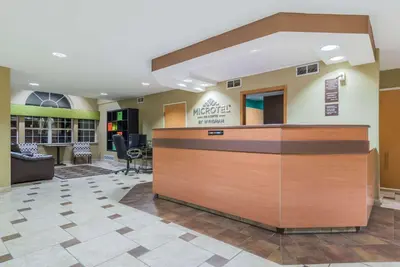 a lobby of a hospital with a reception desk at Microtel Inn & Suites by Wyndham West Chester in West Chester