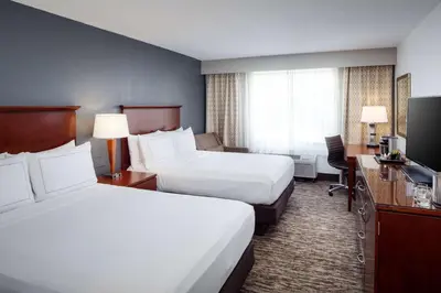 a hotel room with two beds and a television at DoubleTree by Hilton Princeton in Princeton