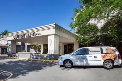 a white van parked in front of a store at DoubleTree by Hilton Princeton in Princeton