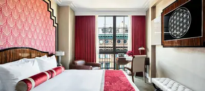 a hotel room with a bed and a window at Walker Hotel Greenwich Village in New York