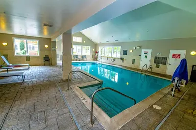 a large swimming pool in a building at Residence Inn by Marriott Woodbridge Edison/Raritan Center in Woodbridge
