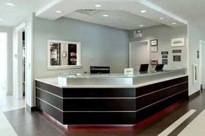 a barbershop with a glass counter in a building at Residence Inn by Marriott Woodbridge Edison/Raritan Center in Woodbridge