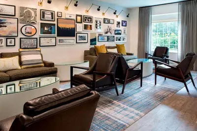 a living room with couches and chairs at Delta Hotels by Marriott Basking Ridge in Basking Ridge