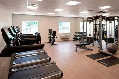 a gym with treadmills and exercise equipment in a room at Delta Hotels by Marriott Basking Ridge in Basking Ridge