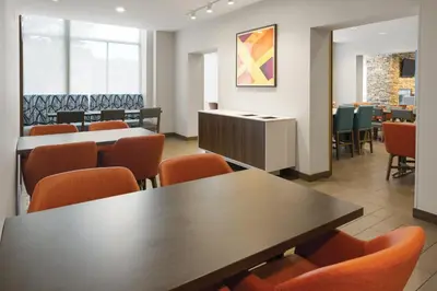 a waiting room with a table and chairs at Holiday Inn Express Philadelphia Penn's Landing by IHG in Philadelphia