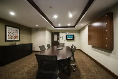 a conference room with a table and chairs at Staybridge Suites Montgomeryville by IHG in North Wales