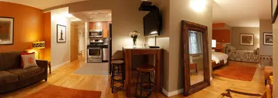 a living room with a couch and a bedroom at Sanctuary NYC Retreats in New York