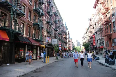a group of people walking down a city street at Sanctuary NYC Retreats in New York