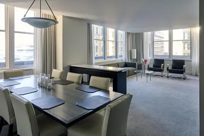 a dining room with a long table and chairs at Loews Philadelphia Hotel in Philadelphia