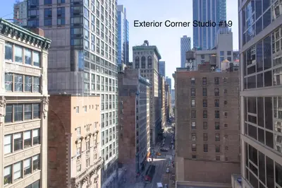 an aerial view of a city with tall buildings at NYC Empire Apartments in New York