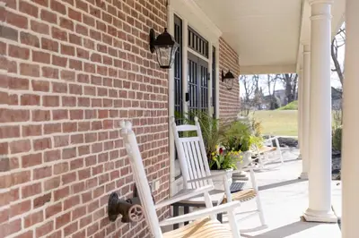 two white rocking chairs on a brick house at Selinsgrove Inn in Selinsgrove