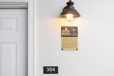 a light on a door with a sign on it at Selinsgrove Inn in Selinsgrove
