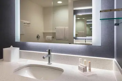 a bathroom with a sink and a large mirror at Residence Inn by Marriott Lancaster in Lancaster