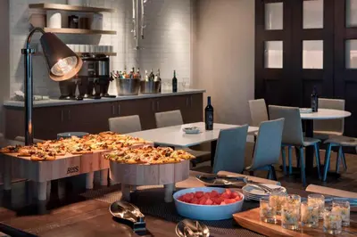 a restaurant with two tables with food on it at Residence Inn by Marriott Lancaster in Lancaster