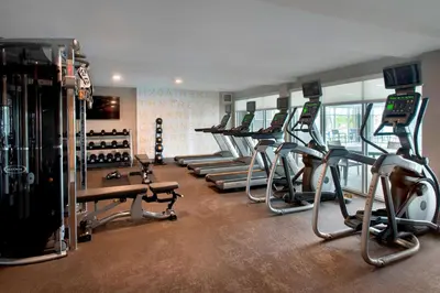 a gym with a row of treadmills and machines at Residence Inn by Marriott Lancaster in Lancaster