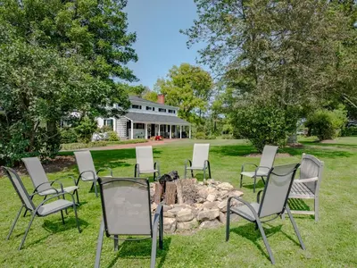 a group of chairs sitting around a fire pit at The Neighbour House B&B in Long Valley
