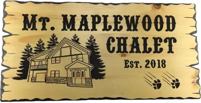 a sign for a merywood chapel with a house at Mt. Maplewood Chalet in Pocono Lake