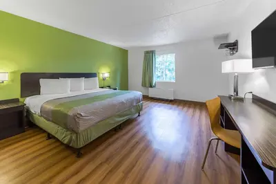 a hotel room with a bed and a desk at Motel 6-Warminster, PA in Warminster