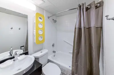 a bathroom with a sink and a toilet and a shower at Motel 6-Warminster, PA in Warminster