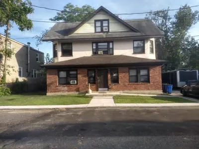 a house on the side of a street at Cappuccio Hotel in Keansburg