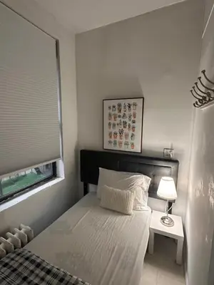a small bedroom with a bed and a window at TIME SQUARE 42nd Street Private Room in New York