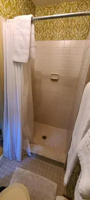 a bathroom with a shower with a shower curtain at General Warren in Malvern