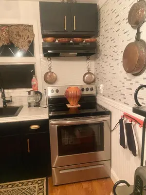 a kitchen with an oven and a sink and a stove at Elegantly English Catskills in Liberty
