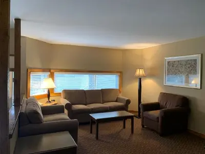 a living room with a couch and chairs and a table at Pocono Villas Resort in East Stroudsburg