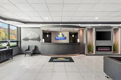 a lobby of a hotel with a sign on the wall at Days Inn by Wyndham Liberty in Ferndale