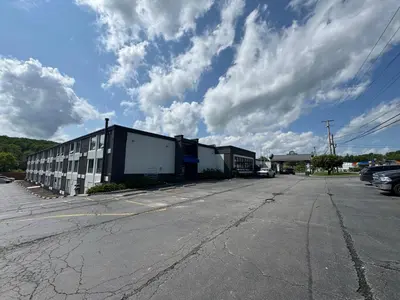 an empty parking lot next to a building at Days Inn by Wyndham Liberty in Ferndale