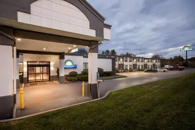 a building with a parking lot in front of it at Days Inn by Wyndham Liberty in Ferndale