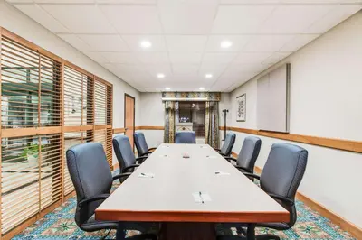 a conference room with a long table and chairs at Wingate by Wyndham - York in York