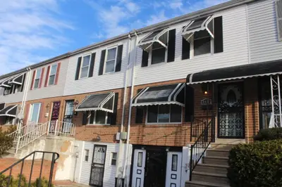 an apartment building with stairs leading to the front door at Tuscany 2900 - Classic Italian Style 3BR w Parking near Airport in Philadelphia