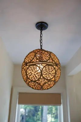 a chandelier hanging from a ceiling over a window at Stonehill's Farmhouse in Accord
