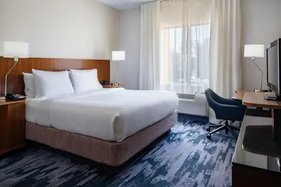 a hotel room with a bed and a desk and a computer at Fairfield Inn & Suites by Marriott Towanda Wysox in Towanda