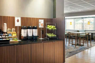 a restaurant with a counter with apples on it at Fairfield Inn & Suites by Marriott Towanda Wysox in Towanda