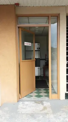 an open door of a building with a sign on it at Hallmark Motel in Cinnaminson