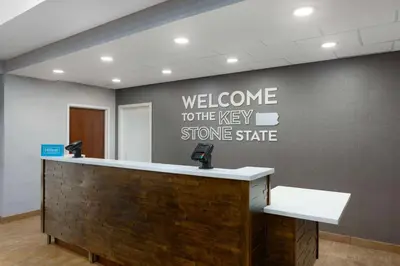a welcome to the very stone state sign on a wall at Hampton Inn & Suites Harrisburg in Harrisburg