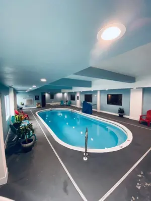 a large swimming pool in a hotel room at La Quinta by Wyndham Harrisburg-Hershey in Harrisburg