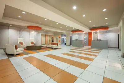 a lobby of a hospital with chairs at La Quinta by Wyndham Harrisburg-Hershey in Harrisburg